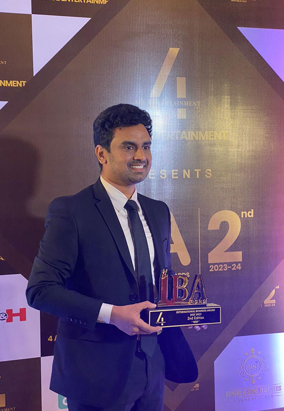 Actor Sonu Sood presenting the Best Web Development and Digital Marketing Agency in Chennai trophy to Kalyan Raj Bandaru on the International Business Awards 2023 stage in New Delhi