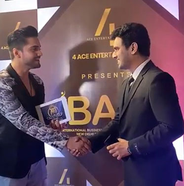 Kalyan Raj Bandaru holding the International Business Award 2023 trophy, plate reading July 2023 2nd Edition